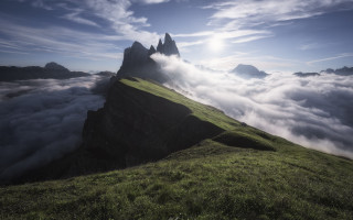 Mountain grassyfield sun clouds ocean - cloud below free wallpaper