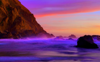 Purple sunset rocks ocean mountains - a rock formation in the ocean free wallpaper