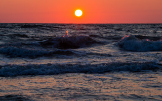 Sunset ocean waves lighthouse red - a lighthouse in the distance free wallpaper