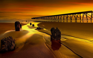 Bridge sunset beach rocks matte - a beach below free wallpaper