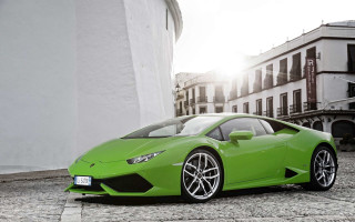 Green sports car cobblestone street 2 - a cobblestone street in front free wallpaper