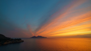 Sunset mystical water island clouds - a small island in the distance free wallpaper