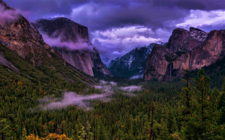 Mountain range valley trees clouds - rich moody colour free wallpaper