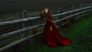 Woman red dress fence night - a dark sky in the background free wallpaper
