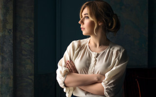 Woman crossed arms window portrait - something outside free wallpaper