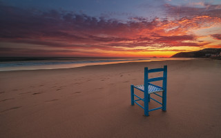 Blue beach chair sunset ocean - eric deschamps free wallpaper