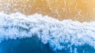 Wave breaking blue yellow white - a wave free wallpaper