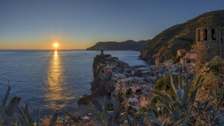 Sunset coastal town mountain lake - water free wallpaper