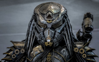 Alien gun helmet biopunk afrofuturism - his hand and a helmet free wallpaper