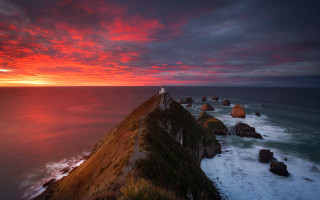 Lighthouse cliff ocean sunset red 2 - a few wave free wallpaper