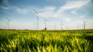 Green grass wind turbines clouds - environmental art free wallpaper