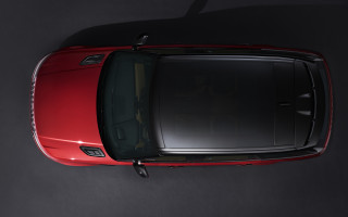 Red car tiltshift photorealism black - a black wall behind free wallpaper