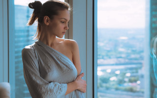 Woman white dress window cityscape - natural free wallpaper