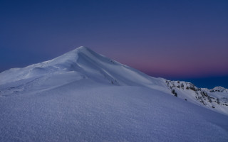 Snowy mountain pink sky night - a pink sky in the background free wallpaper