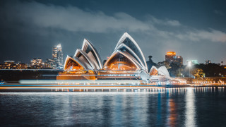 Large building city lights water - free architecture wallpaper