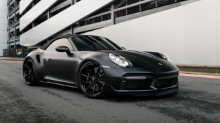 Grey sports car parked white - a grey sports car free wallpaper for desktop