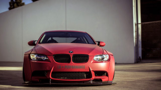 Red car white wall black 2 - a white wall behind free wallpaper