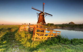 Windmill greenfield river landscape forest - a lush green field next free wallpaper