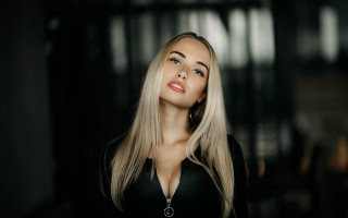 Blonde woman black shirt dark 2 - a black wall free wallpaper