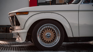 White car brown rim garage - a garage area free wallpaper