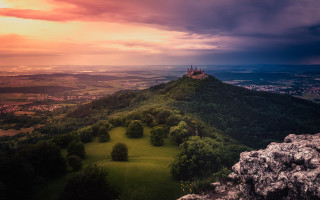 Castle hill sunset clouds greenfield - a green field below free wallpaper