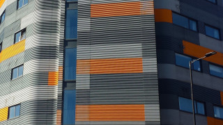 Skyscraper clock streetlight fence fishnets - sharp high detail free wallpaper