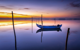 Sunset boat reflection clouds ocean - tranquil free wallpaper for desktop