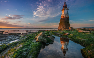 Lighthouse rocky shore sunset magic - a rocky shore free wallpaper for desktop