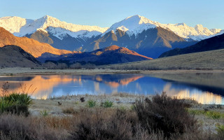 Mountain lake snow capped sky 5 - a lake in the foreground free wallpaper