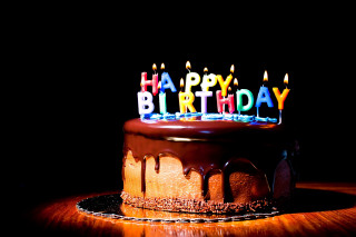 Birthday cake lit candles dark 3 - a birthday cake free wallpaper