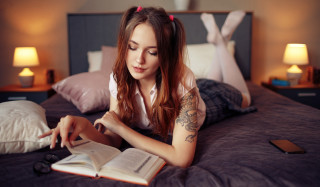 Woman reading bed stockings manga - a bookmark free wallpaper