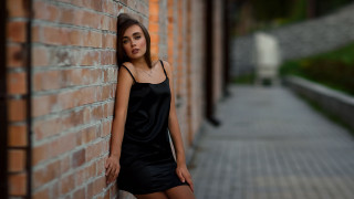 Woman brick wall black dress - a woman leaning against a brick wall free wallpaper