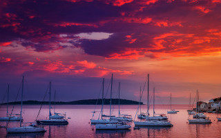 Boats water clouds sunset cityscape - water under a cloudy sky free wallpaper