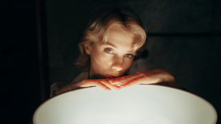 Woman holding white plate serious - a white plate free wallpaper