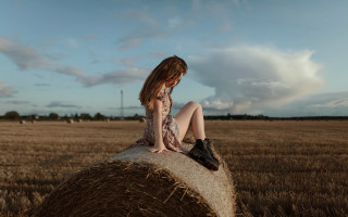 Girl hay bale wheat sky - artur tarnowski free wallpaper