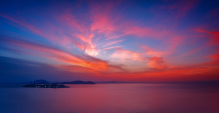 Sunset water island clouds magic 2 - a small island in the distance free wallpaper