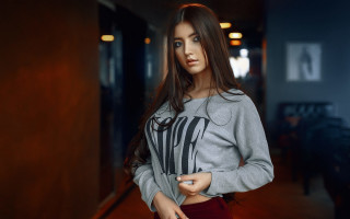 Woman grey sweater hallway blue - a hallway free wallpaper