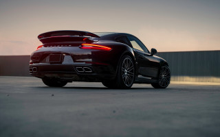 Black sports car sunset rearlights - a black sports car free wallpaper for desktop
