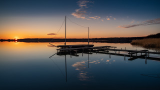 Docked boat sunset reflections mountain - a dock free wallpaper for desktop