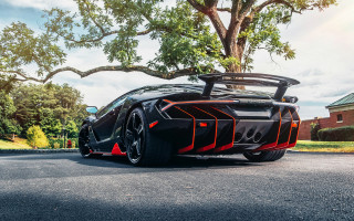 Black sports car tree blue - a black sports car free wallpaper