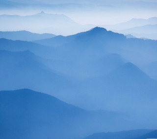 Mountain range foggy day plane - free mountains wallpaper for tablet
