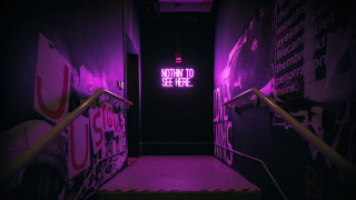 Purple light stairwell down sign - a sign free wallpaper