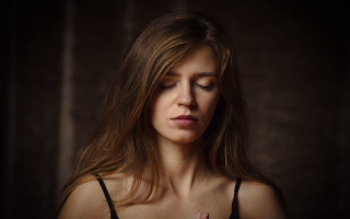 Prayer woman closed eyes dark - a dark room free wallpaper for desktop