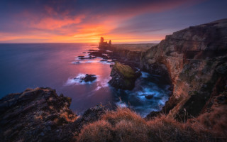Sunset rocky cliff lighthouse dusk - a sunset over a rocky cliff free wallpaper