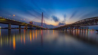 Bridge night lights reflection clouds - free city wallpaper