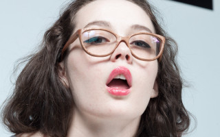 Woman glasses surprised face open - tongue free wallpaper for desktop
