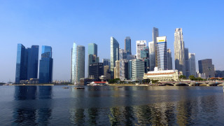 City skyline bridge boat water - a boat in the foreground free wallpaper