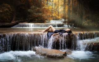 Woman waterfall rock outdoors longhair - a waterfall behind her free wallpaper