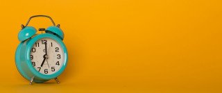 Blue alarm clock yellow wall - a yellow wall free wallpaper