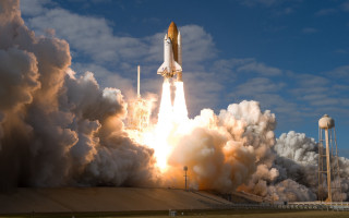 Rocket launching smoke cloudy sunset - back end free wallpaper